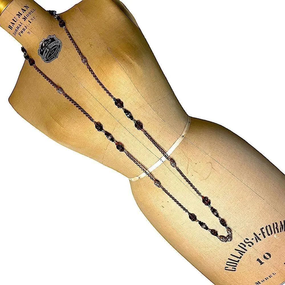 Gold tone long chain for layering has amber gemstones and Diamante gems 59” long